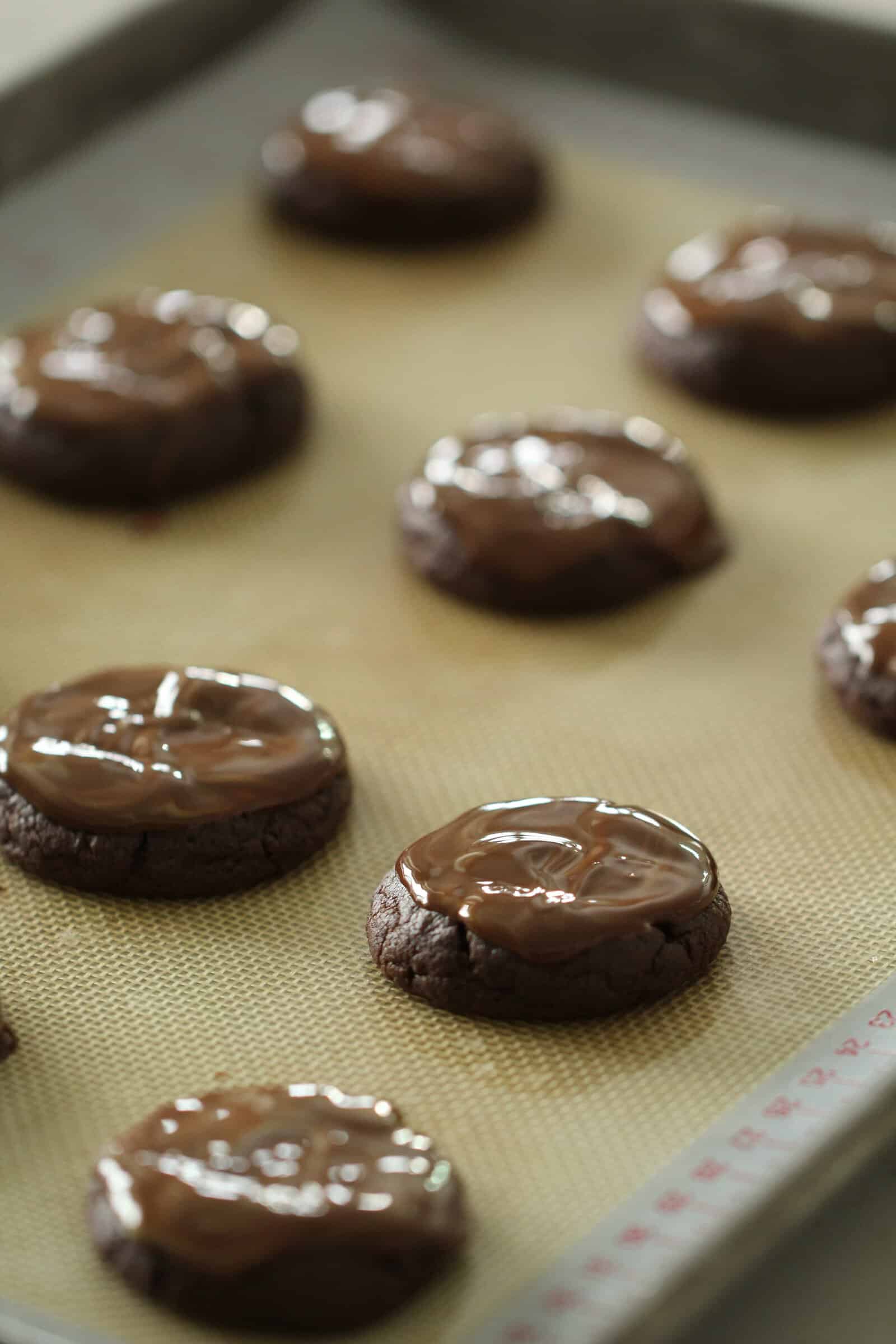 Mints melted on top of warm cooked cookies.