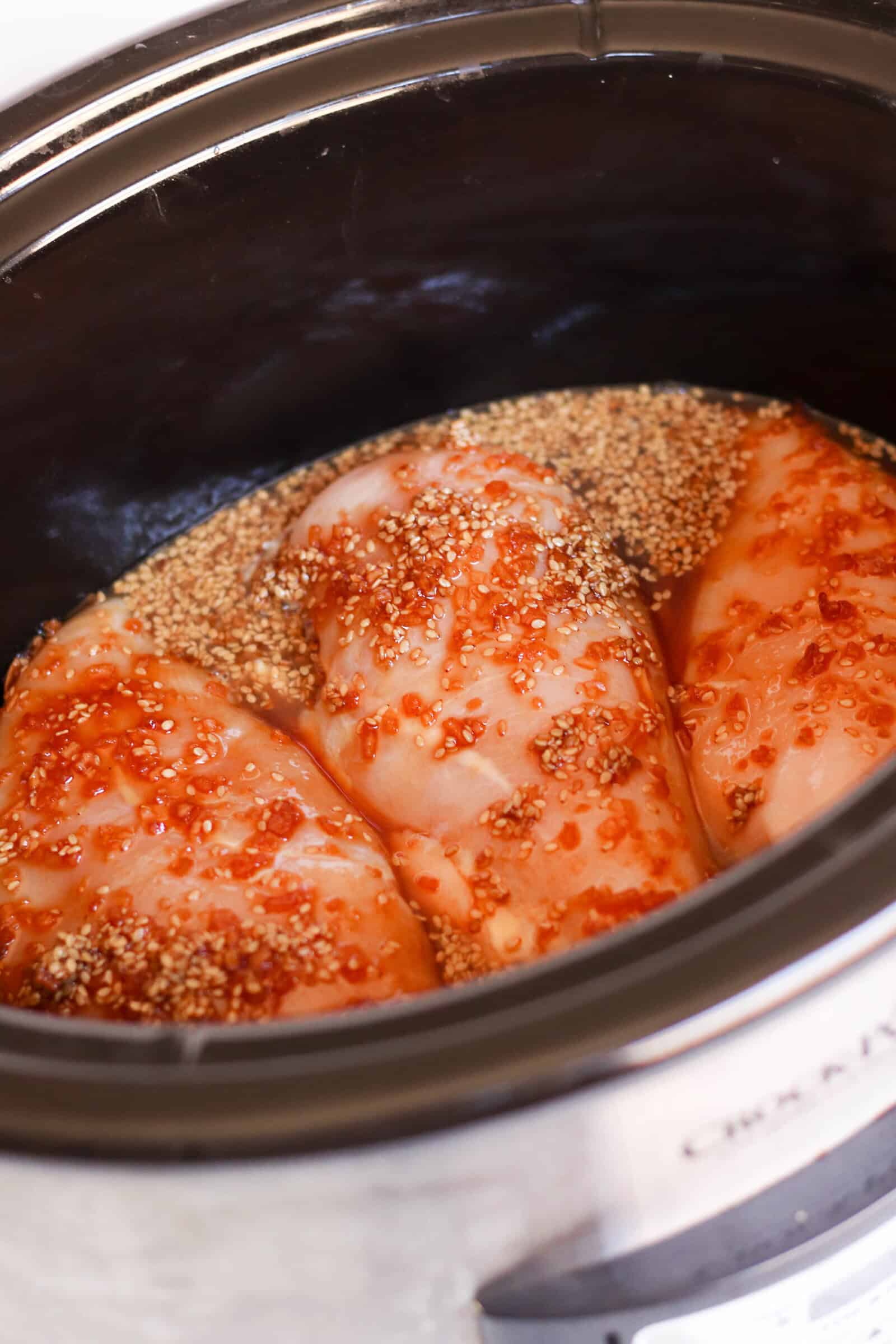 Slow Cooker Teriyaki Chicken with seasonings in the slow cooker