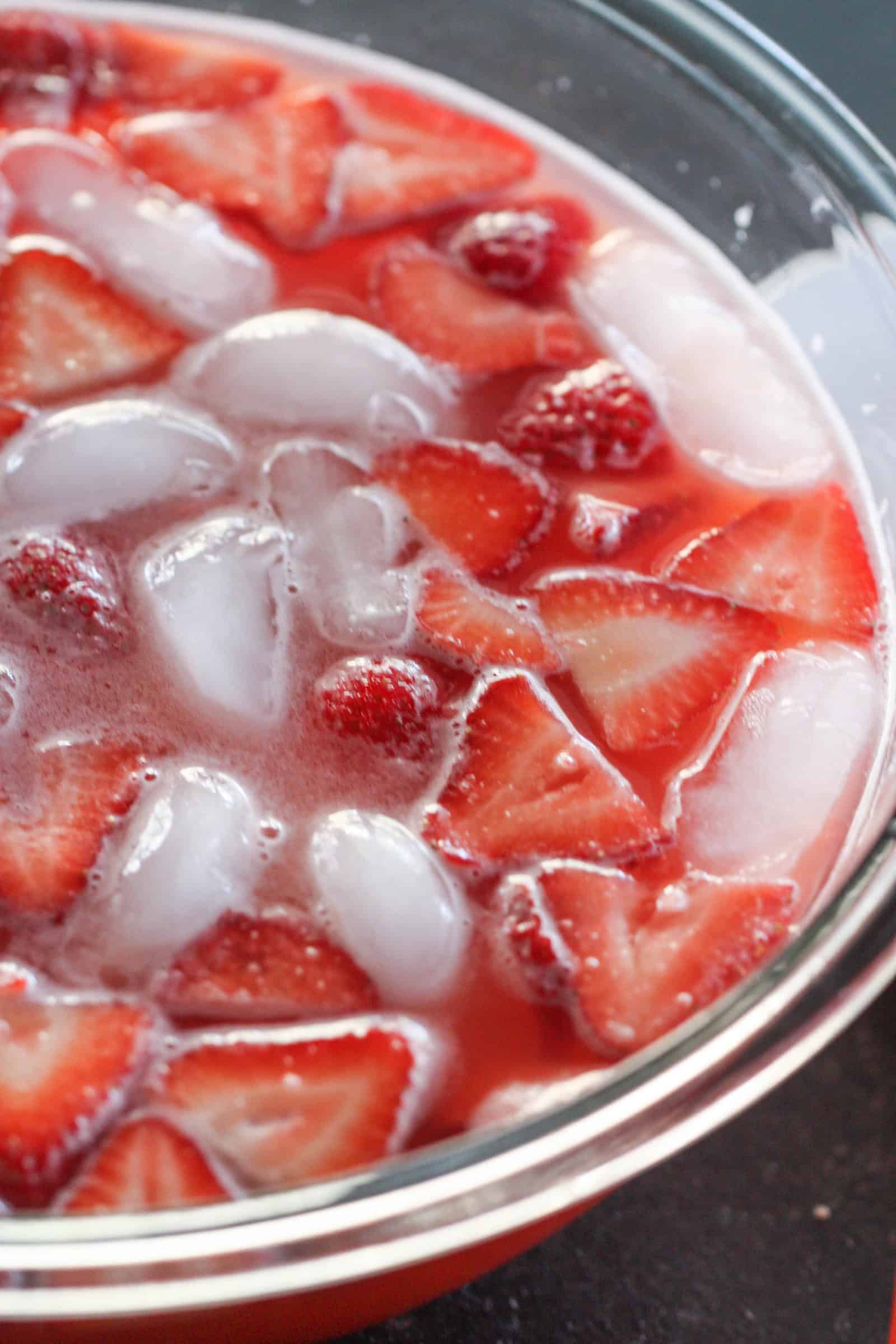 Strawberry Slush Drink in a punch bowl with ice