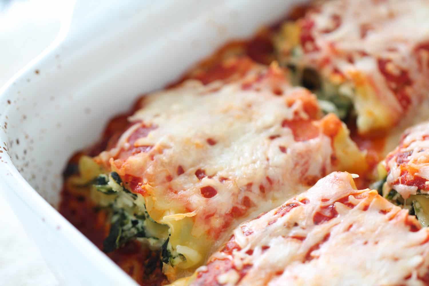 Spinach Lasagna Rolls in a pan