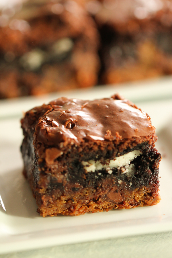 Ultimate Chocolate Chip Cookie n’ Oreo Fudge Brownie Bar on a white plate