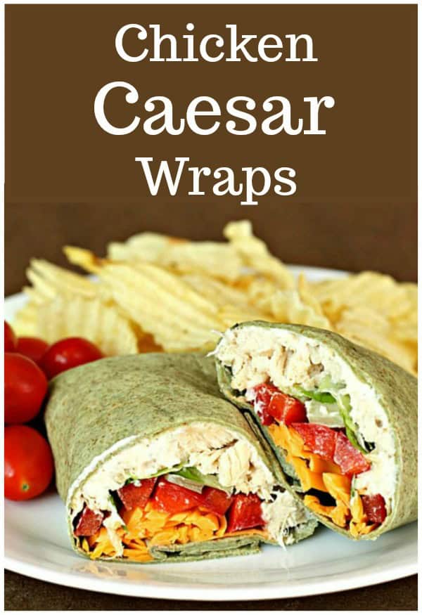 chicken caesar salad wraps served with tomatoes and chips