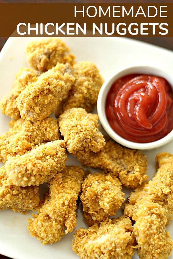 Homemade Baked Chicken Nuggets on a plate with a side of ketchup