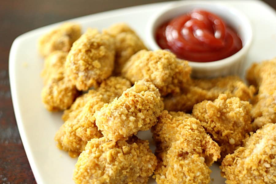 Homemade Baked Chicken Nuggets on a plate with a side of ketchup