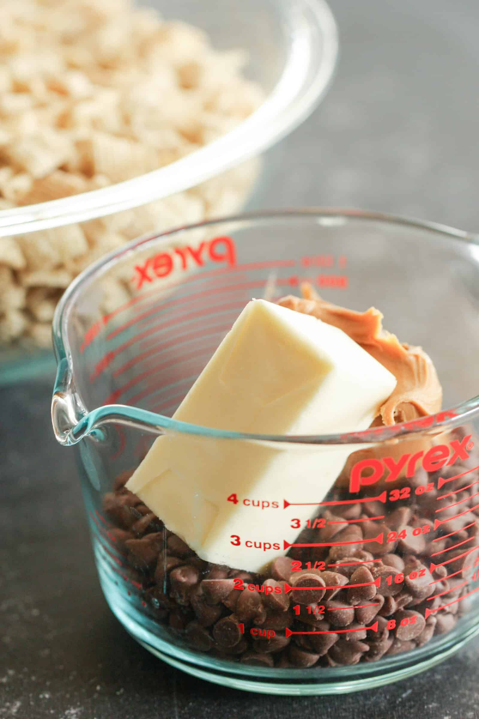 Butter, Peanut Butter and Chocolate chips in a glass measuring cup