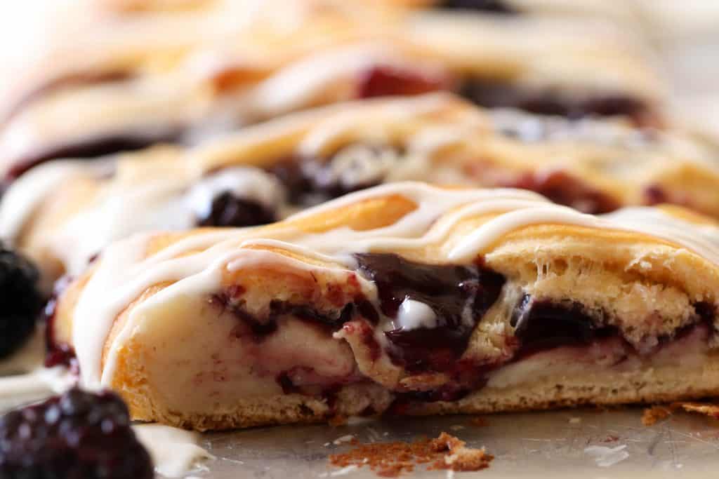 Side view of a sliced Blackberry and Cream Cheese Danish.
