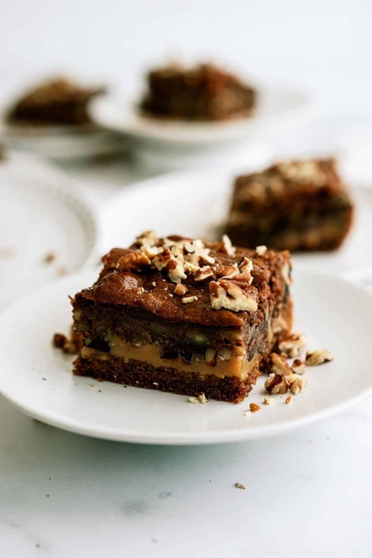 Chocolate Turtle Poke Cake - Mom Loves Baking