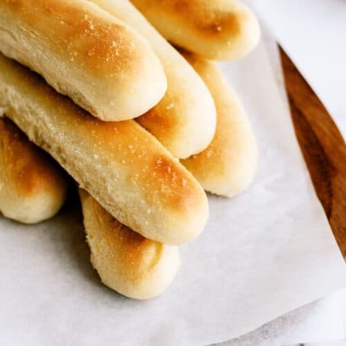Copycat Olive Garden breadsticks on a white piece of paper.