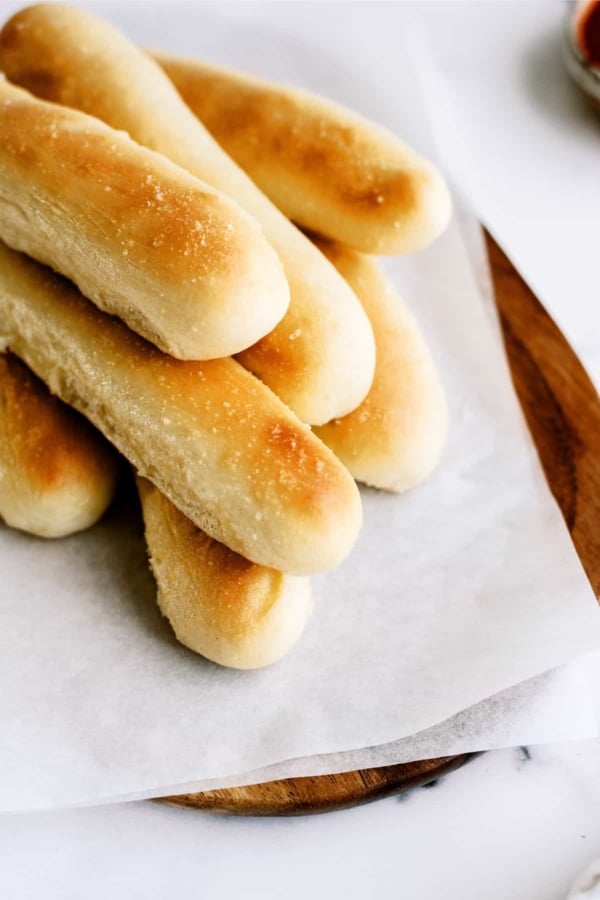 Copycat Olive Garden breadsticks on a white piece of paper.