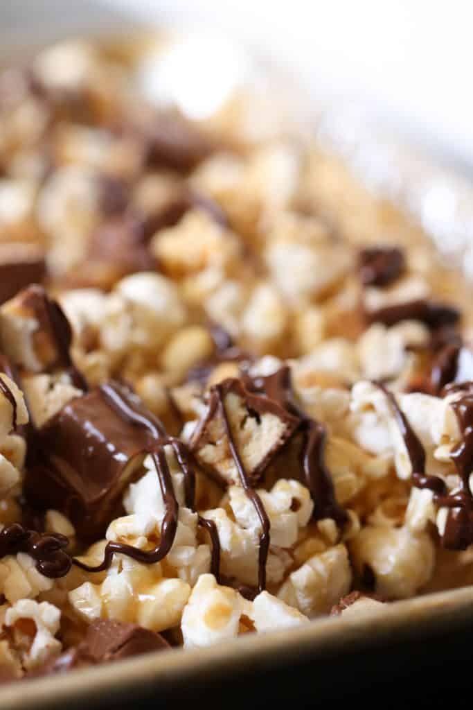 Close up of Snickers popcorn in a sheet pan.