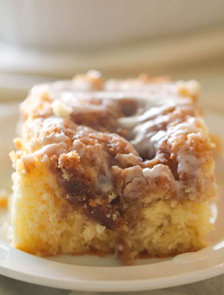 Slice of Cinnabon Cinnamon Roll Cake on a white plate