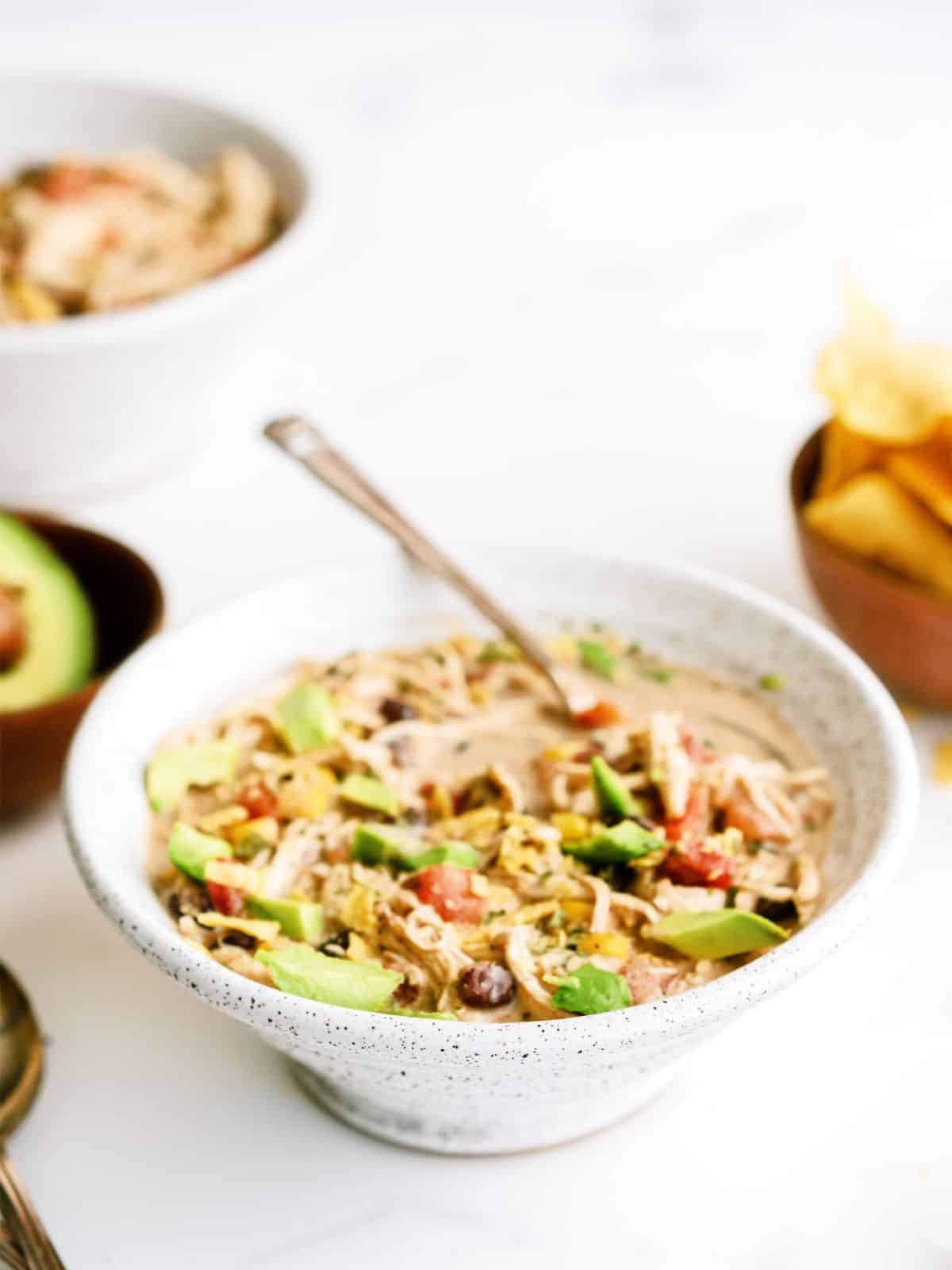 A bowl of Slow Cooker Cream Cheese Chili on a counter