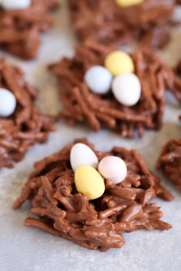 Chocolate bird nest cookies topped with egg shape candies.