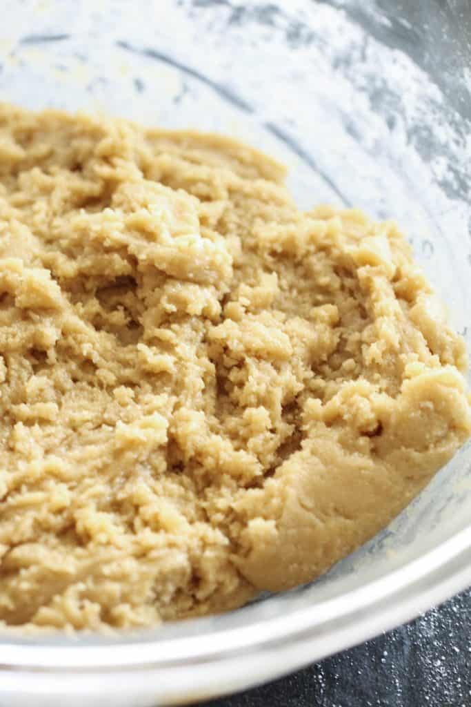 Dough for Cadbury Mini Egg Blondies in a glass bowl.