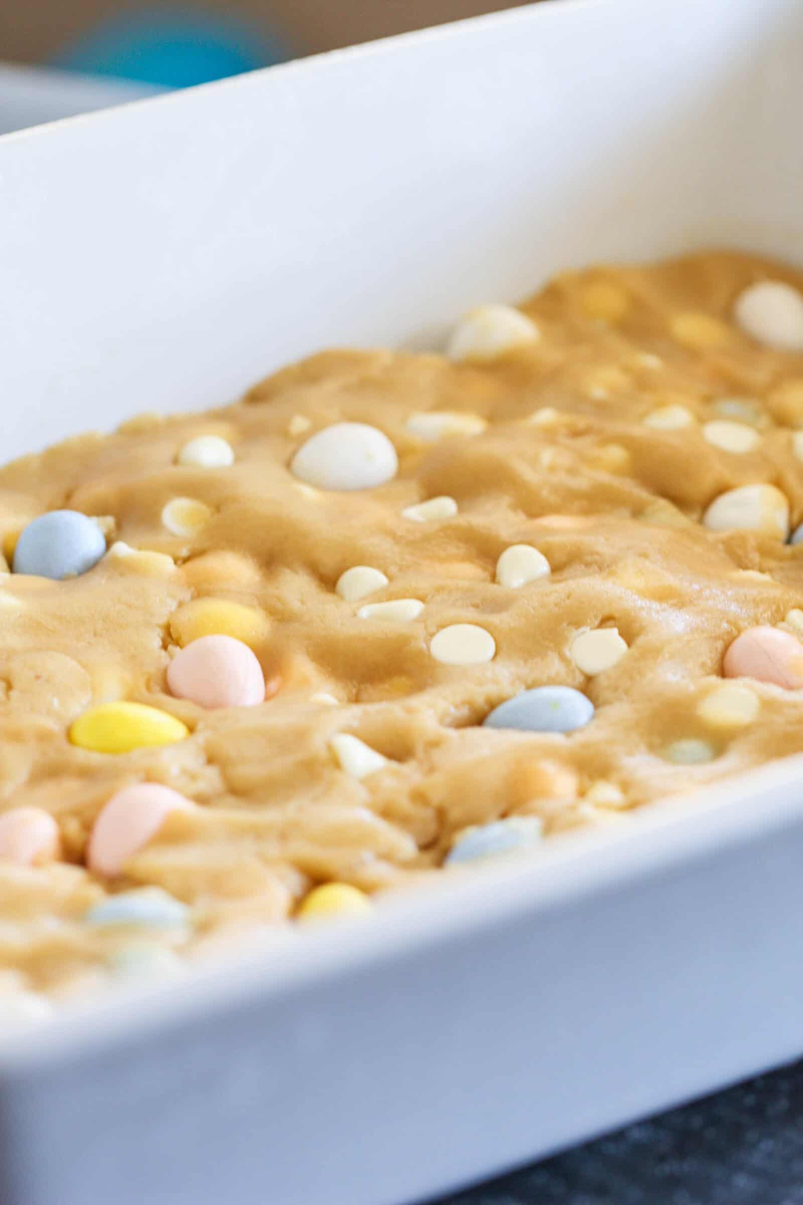 Press Cadbury Mini Egg Blondies dough into baking dish