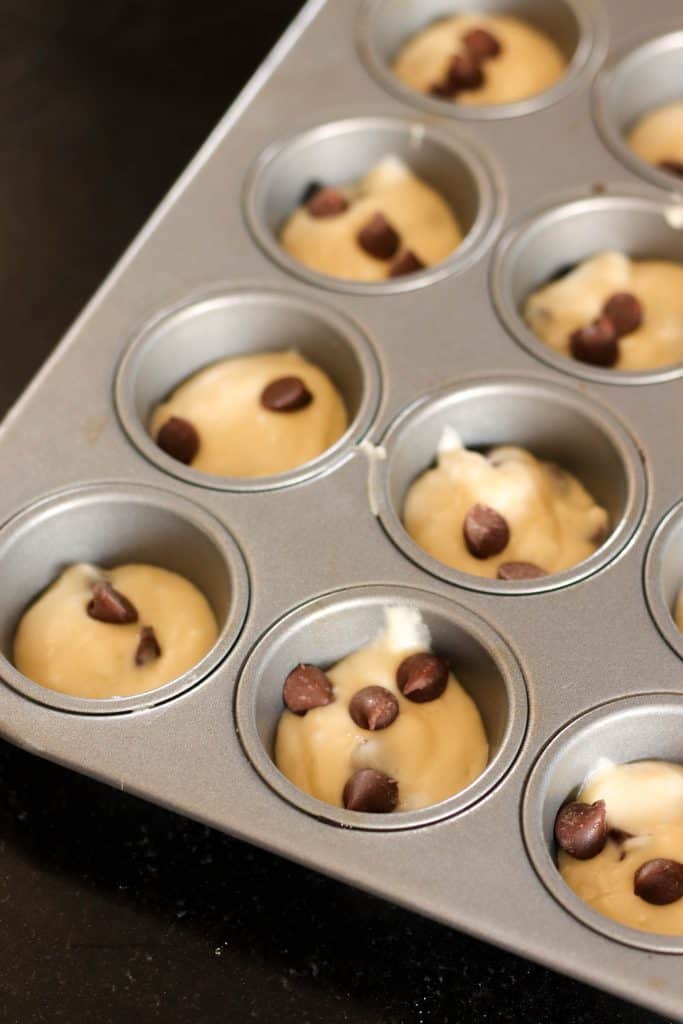 Mini Maple Pancake Muffin batter in a muffin tin.