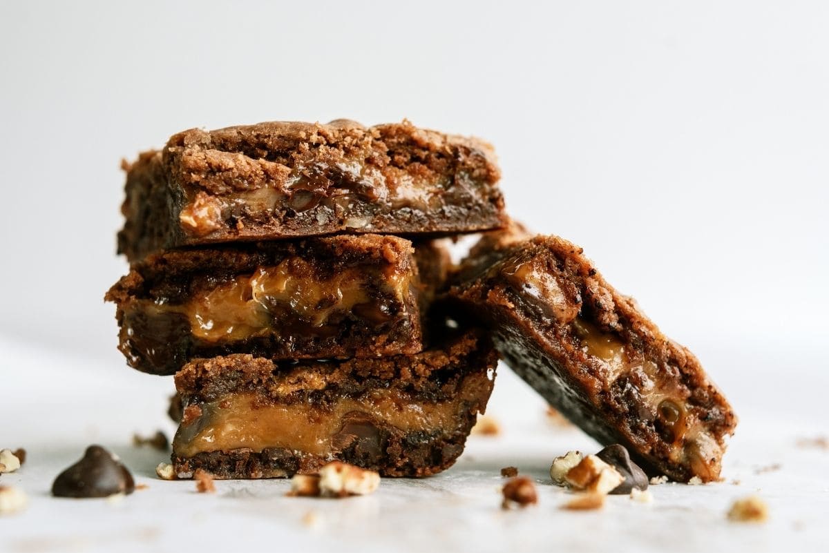 Cake Mix Caramel Brownies cut into squares and stacked