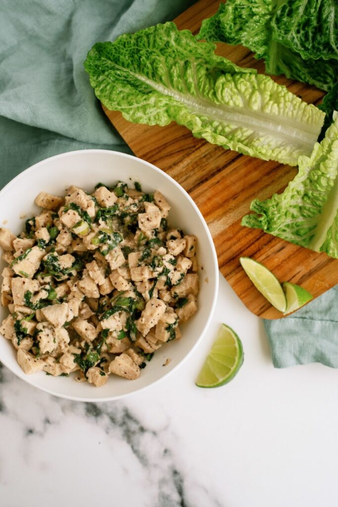 Chicken Lime Lettuce Wraps with the chicken in a bowl ready to spoon onto lettuce