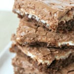 Chocolate marshmallow brownies stacked on a plate