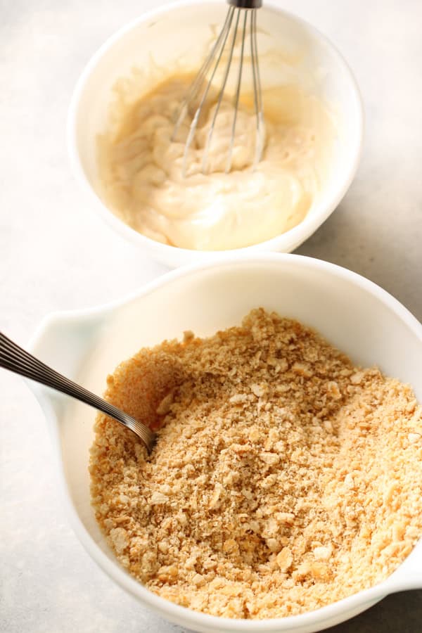 Crumb mixtures in white bowl for Parmesan Sesame Chicken Strips