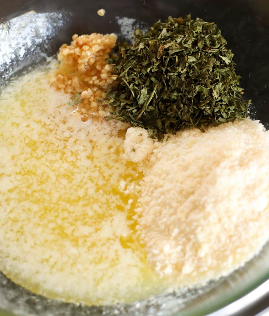 Sauce ingredients for Mini Garlic Monkey Bread in a mixing bowl.