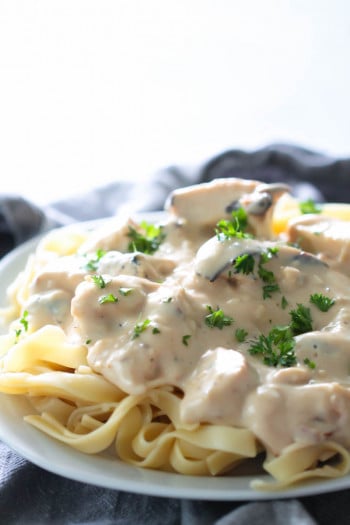 chicken Alfredo made healthier with less fat served with fettecine