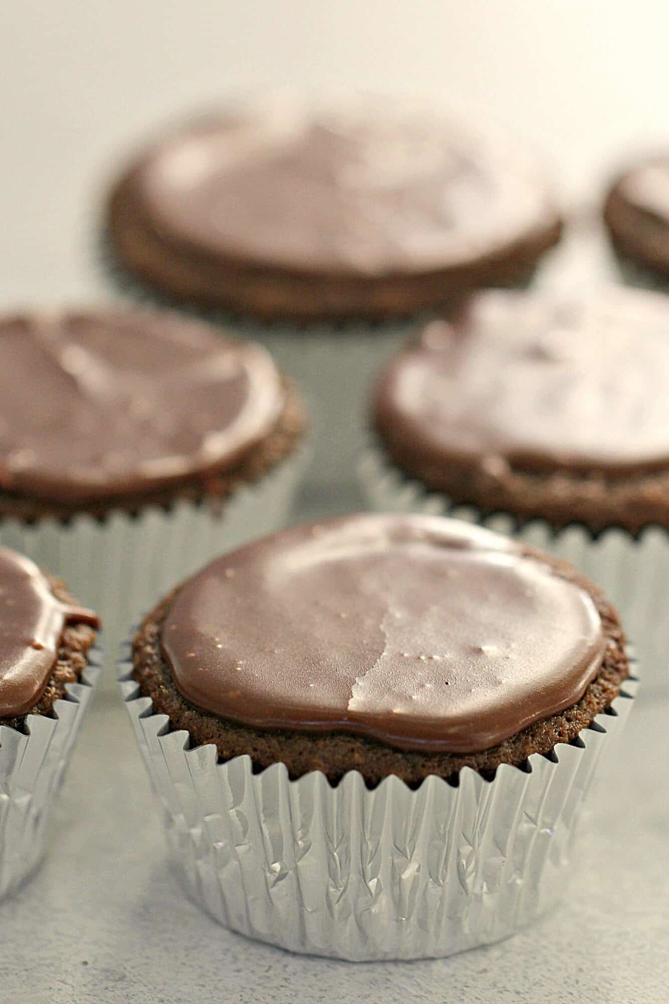 Texas Sheet Cake Cupcakes on the counter frosted