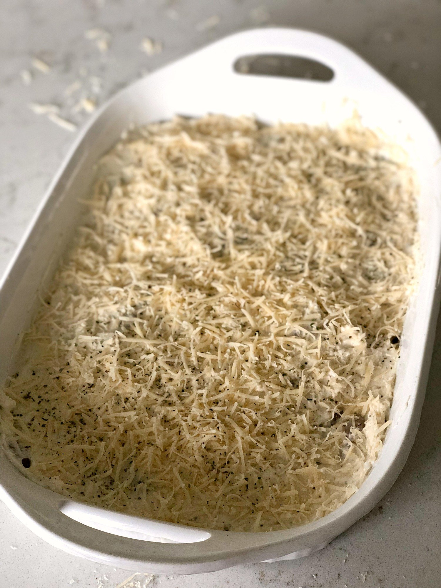 Parmesan Chicken Bake unbaked in a casserole dish