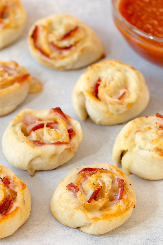Pepperoni Pizza Rolls with a side of sauce