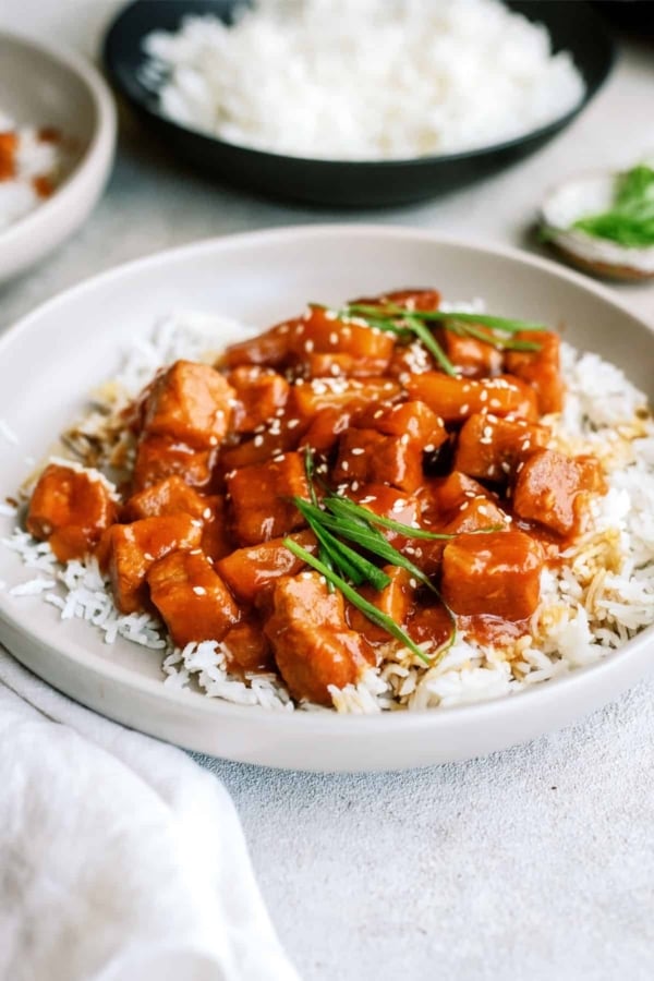 slow cooker sweet and tangy pork served over rice