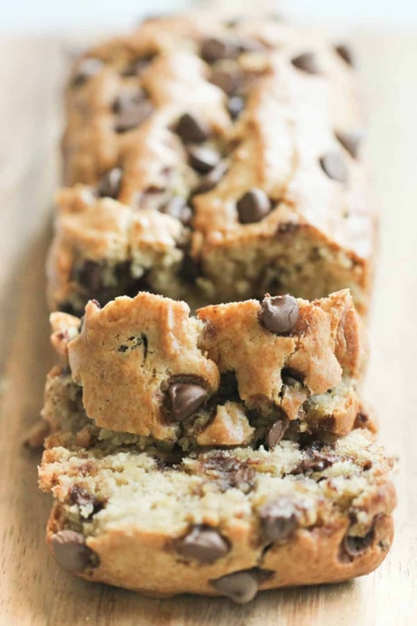 Closeup of a sliced loaf of peanut butter chip banana bread slices