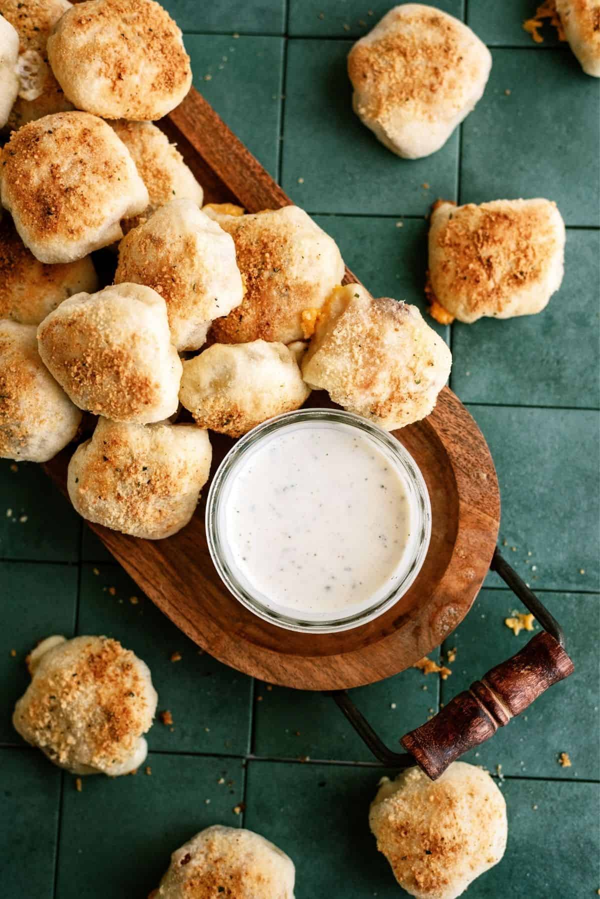 Chicken Bacon Ranch Pizza Rolls with a small bowl ranch