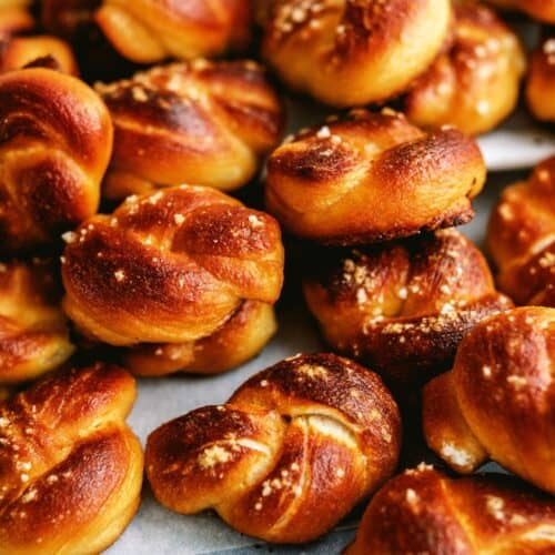 Twisted Soft Pretzel Bites with a small dish of queso.