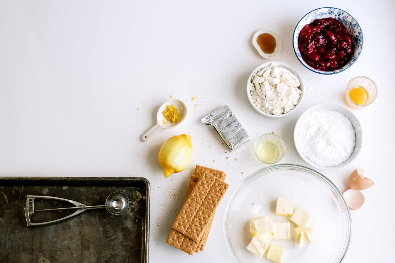 Ingredients for Cherry Cheesecake Cookies: lemon zest, butter, graham crackers, egg, powdered sugar, cherry pie filling, flour