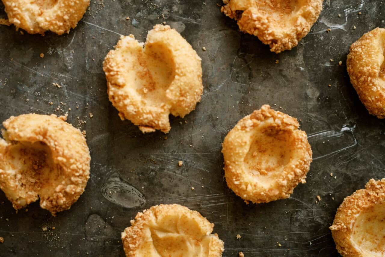 Cherry cheesecake cookies with a thumbprint dent for filling