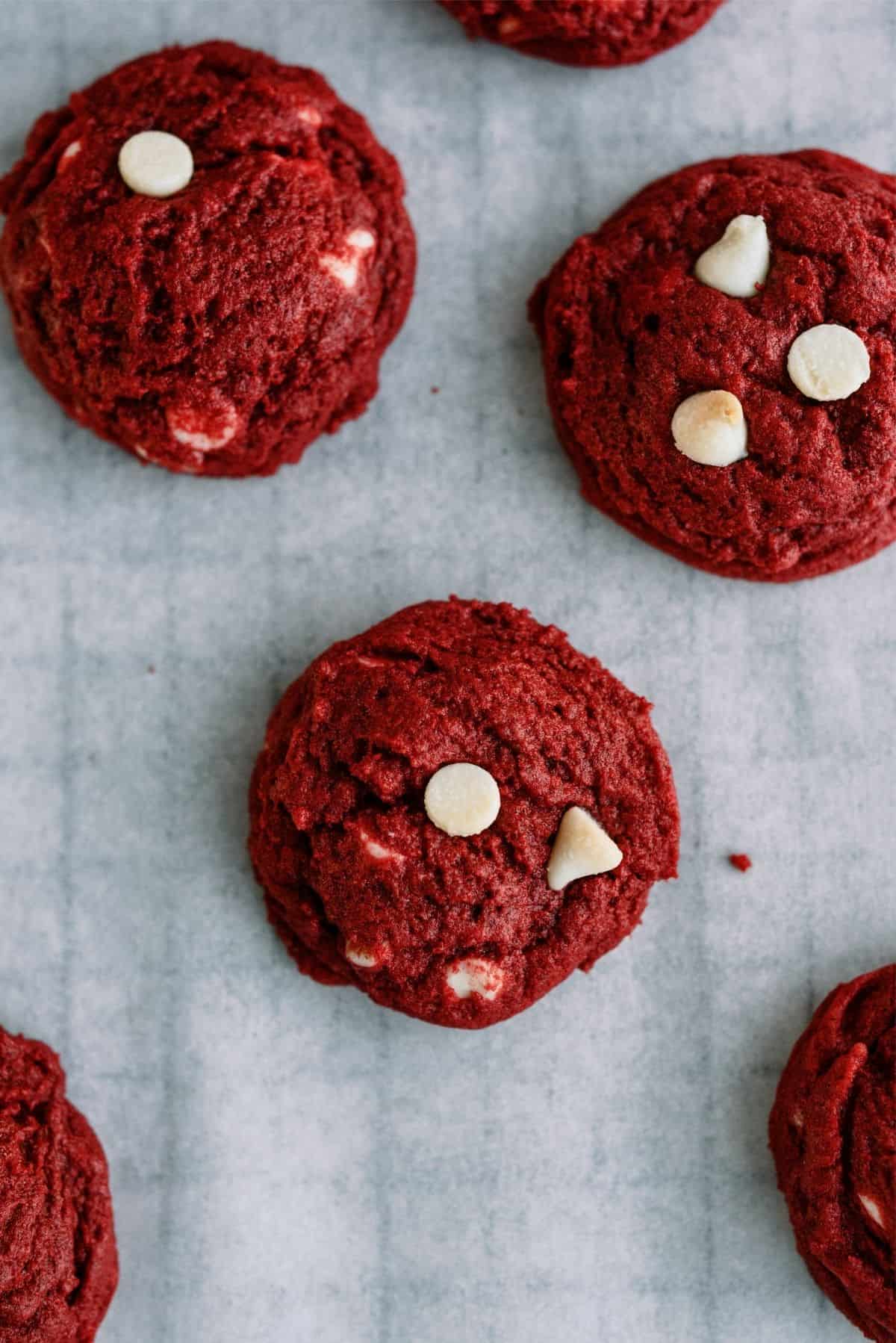 Red Velvet White Chocolate Chip Cookies on a cooling rack