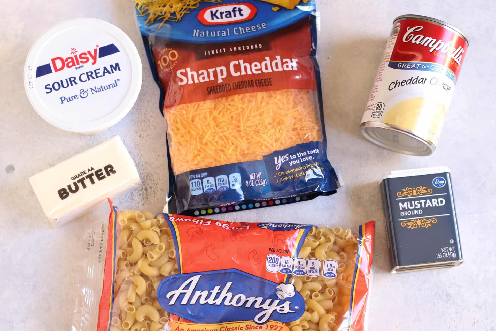 Ingredients in slow cooker macaroni and cheese spread out on the counter