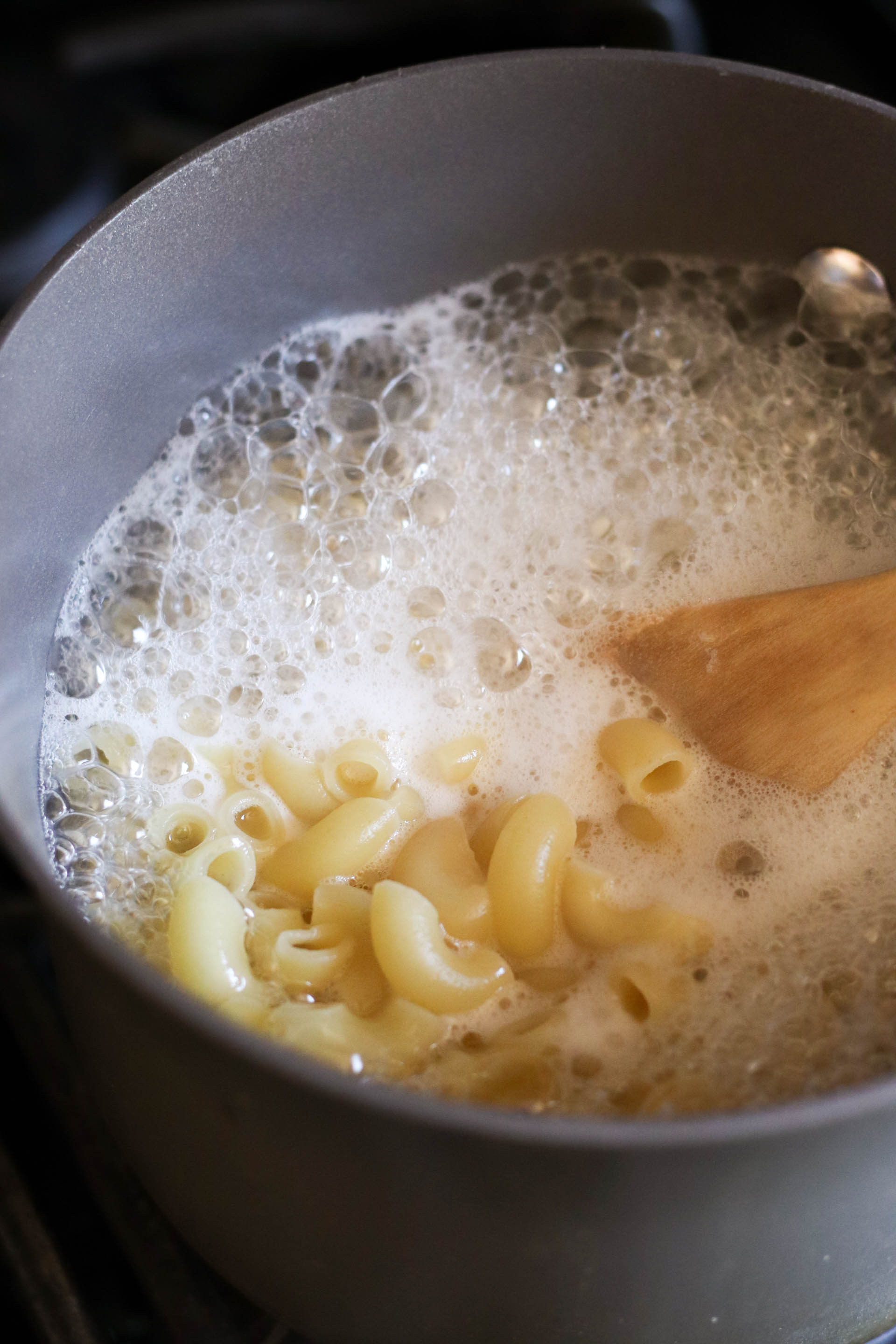 macaroni boiling in water in a saucepan