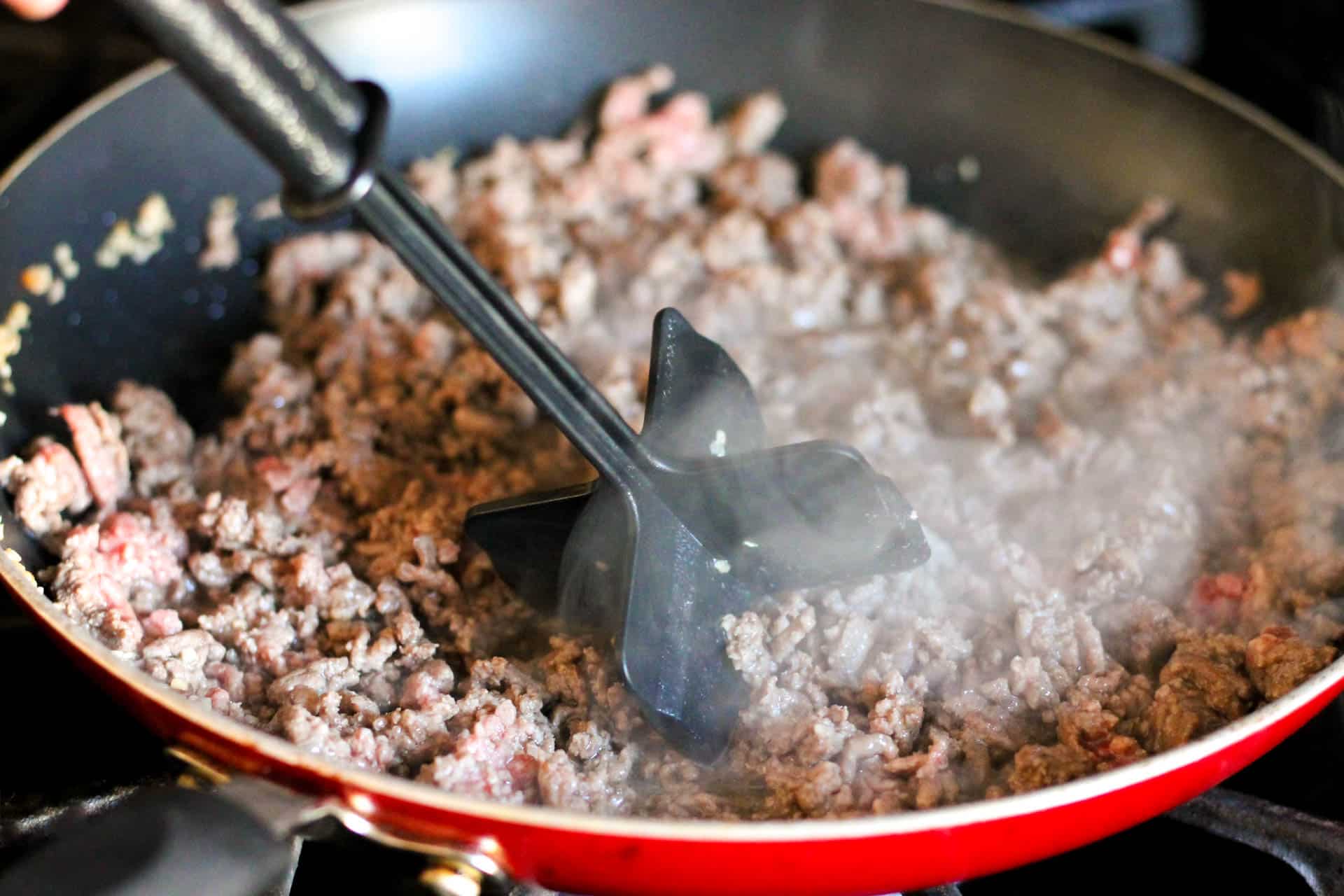 Browning ground beef in skillet