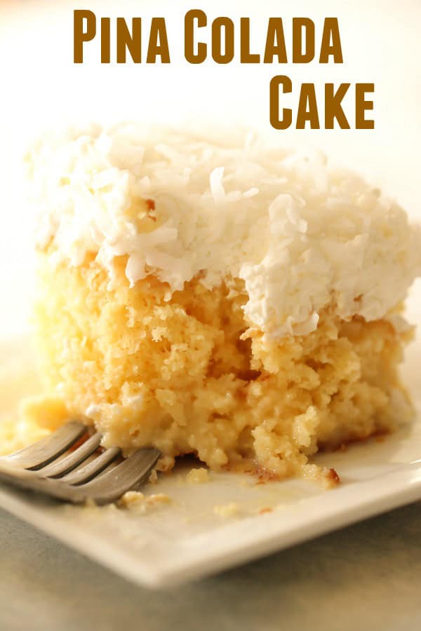 Pina Colada Cake on a plate with a fork