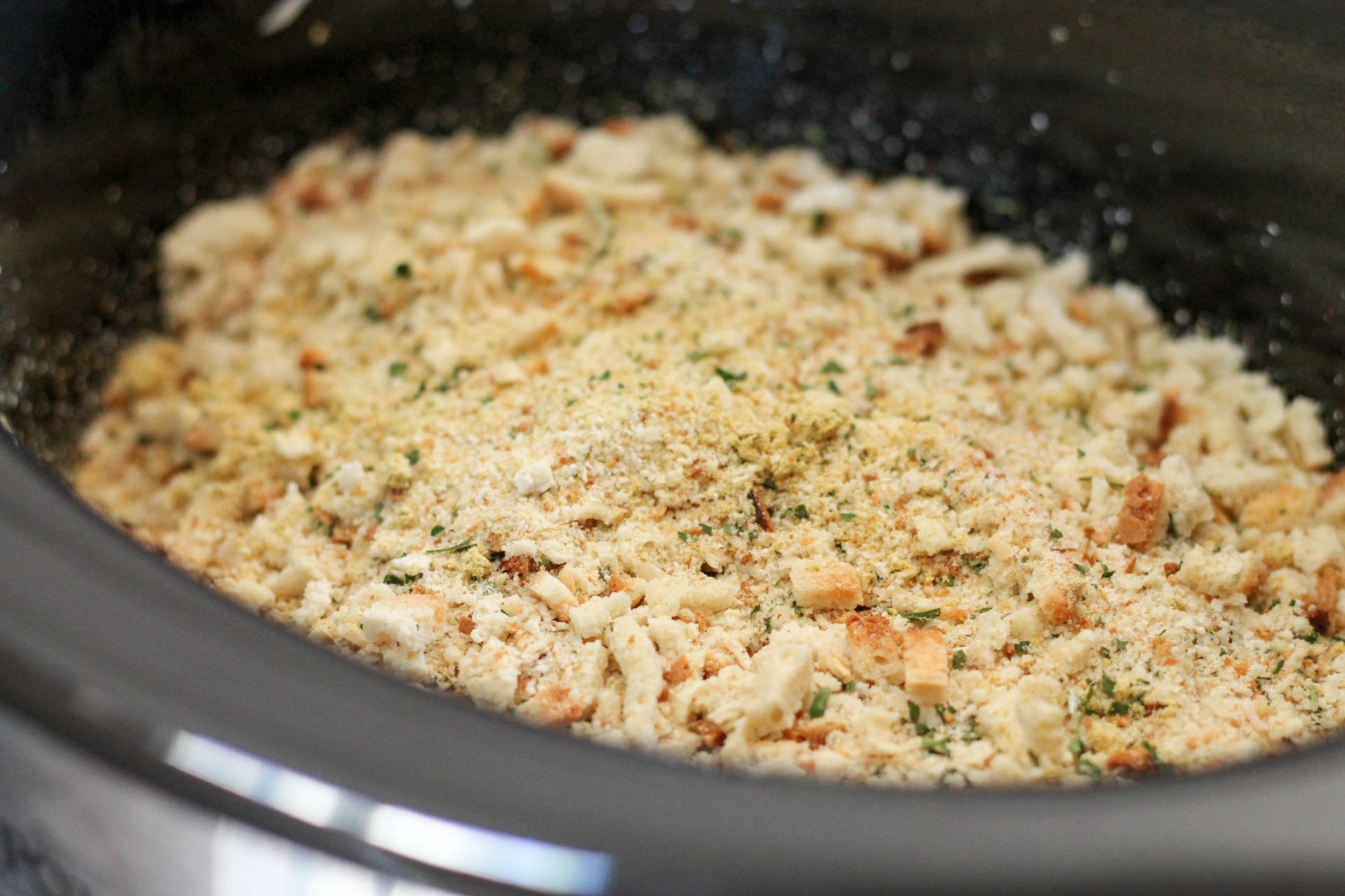 Stuffing mix on top of raw chicken and cheese in the slow cooker