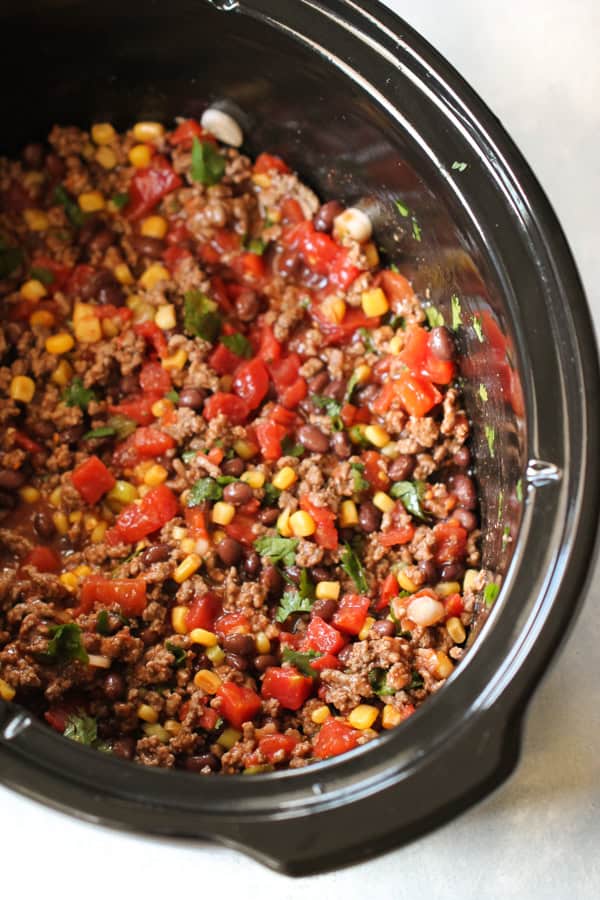 Meat mixture in the bottom of slow cooker