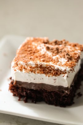 A slice of Chocolate Pudding Cake on a white plate.