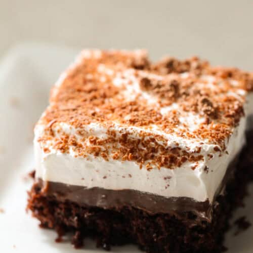 A slice of Chocolate Pudding Cake on a white plate.
