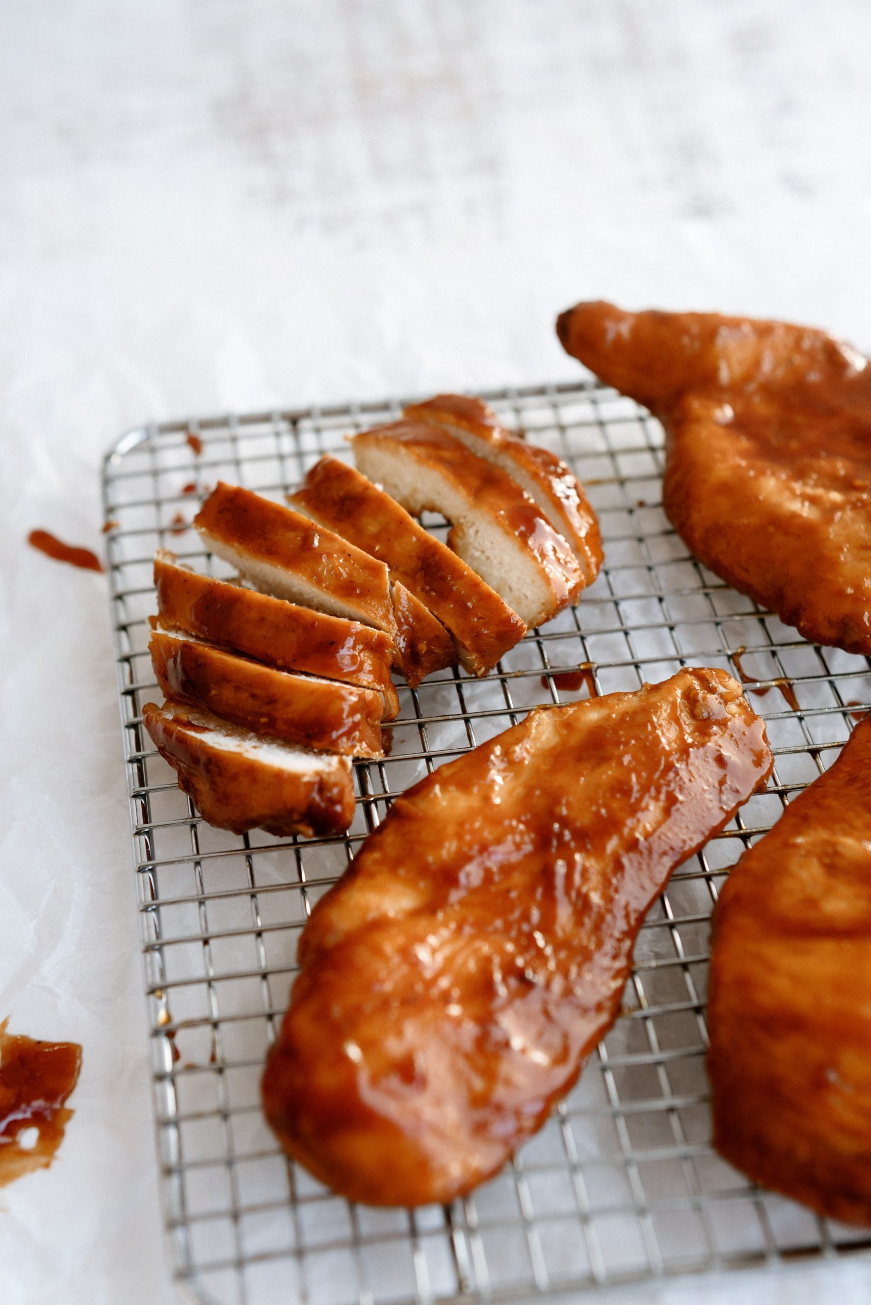 Slow Cooker Sweet BBQ Chicken on a cooling rack