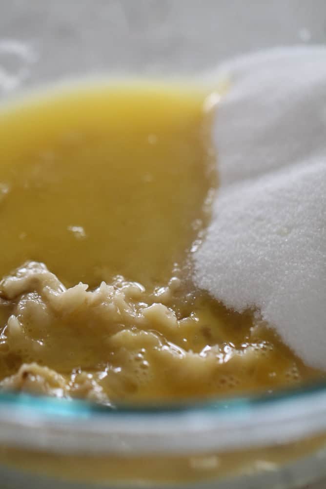 banana, sugar and egg in a bowl