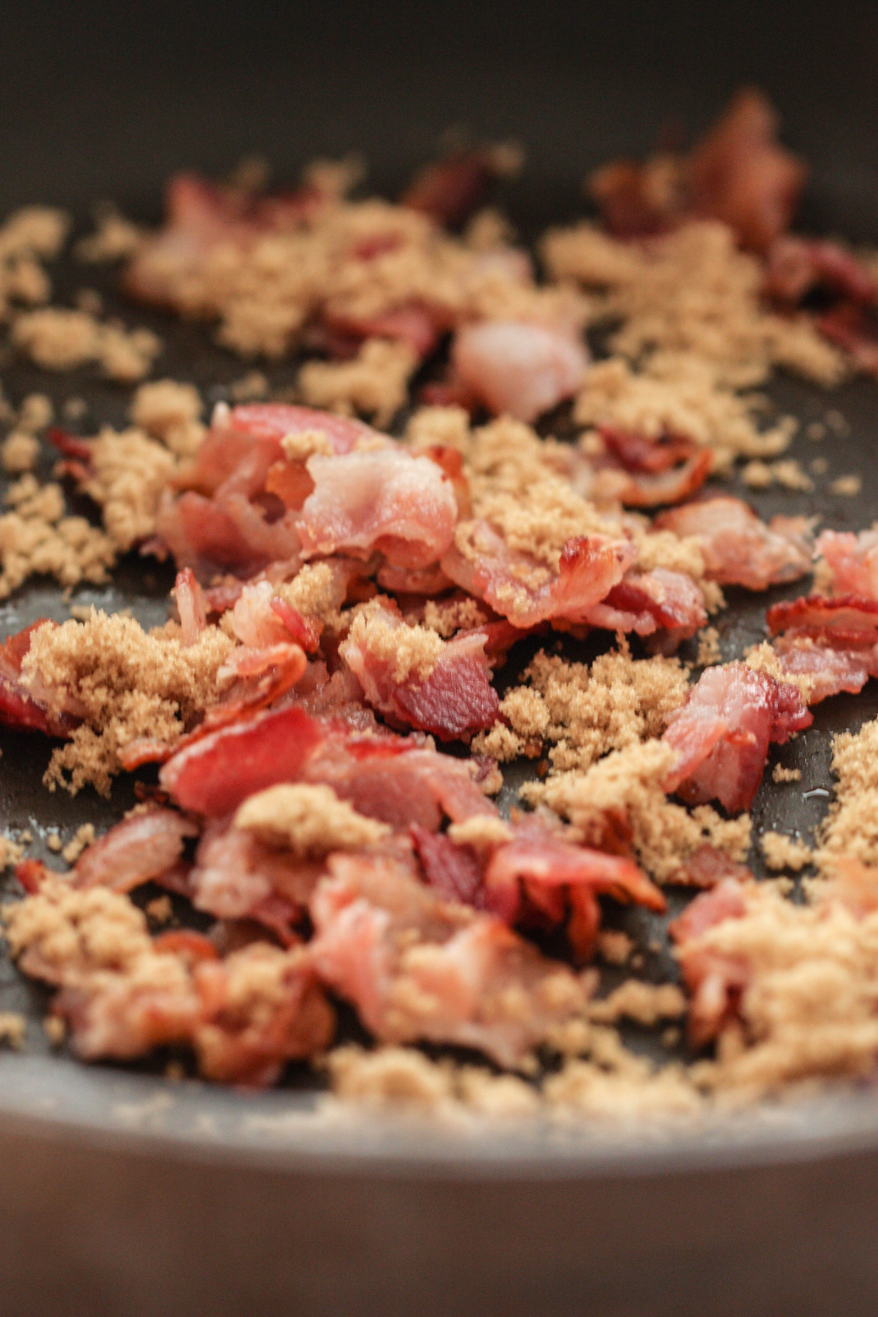 Crumbled Bacon and brown sugar in a pan