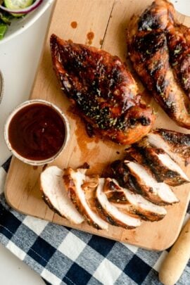 Sliced marinated root beer grilled chicken on a cutting board