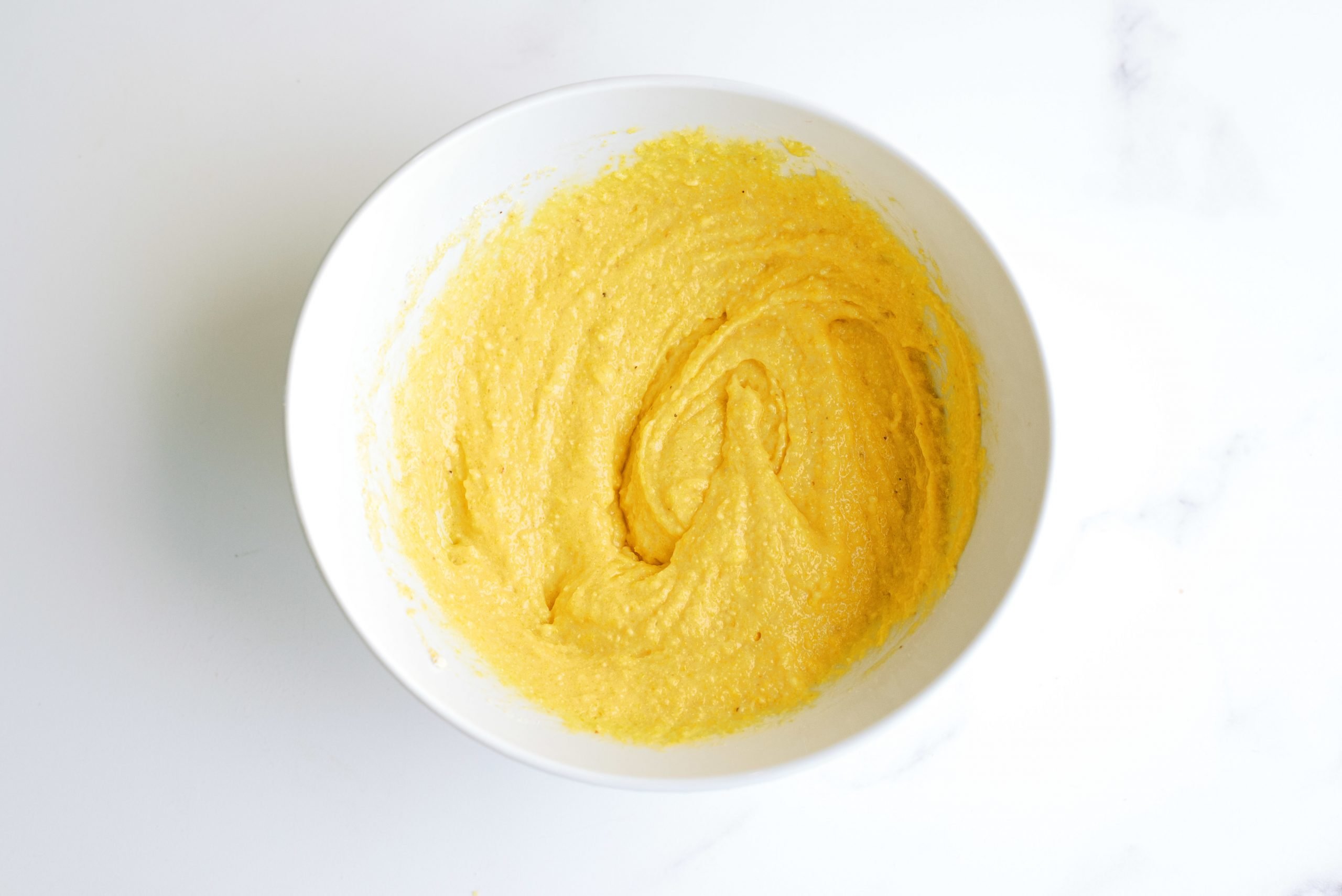 Corn Muffin mixture in mixing bowl