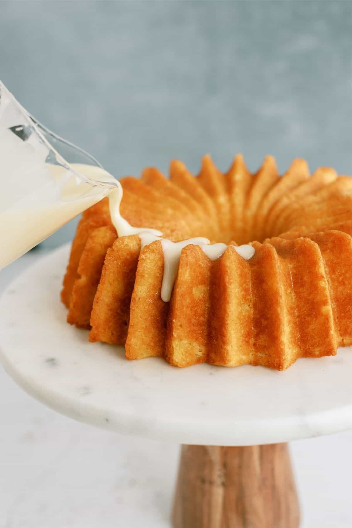 Pouring icing on cooled bundt cake